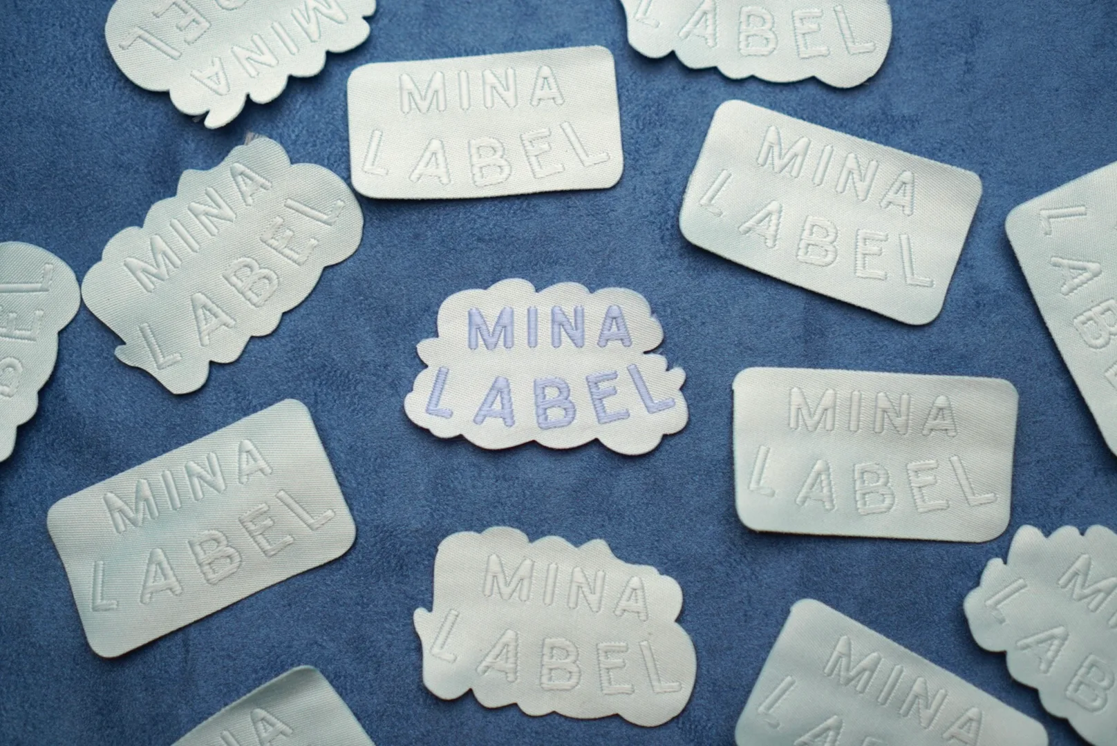 Detail kualitas tinggi Logo Woven Mina